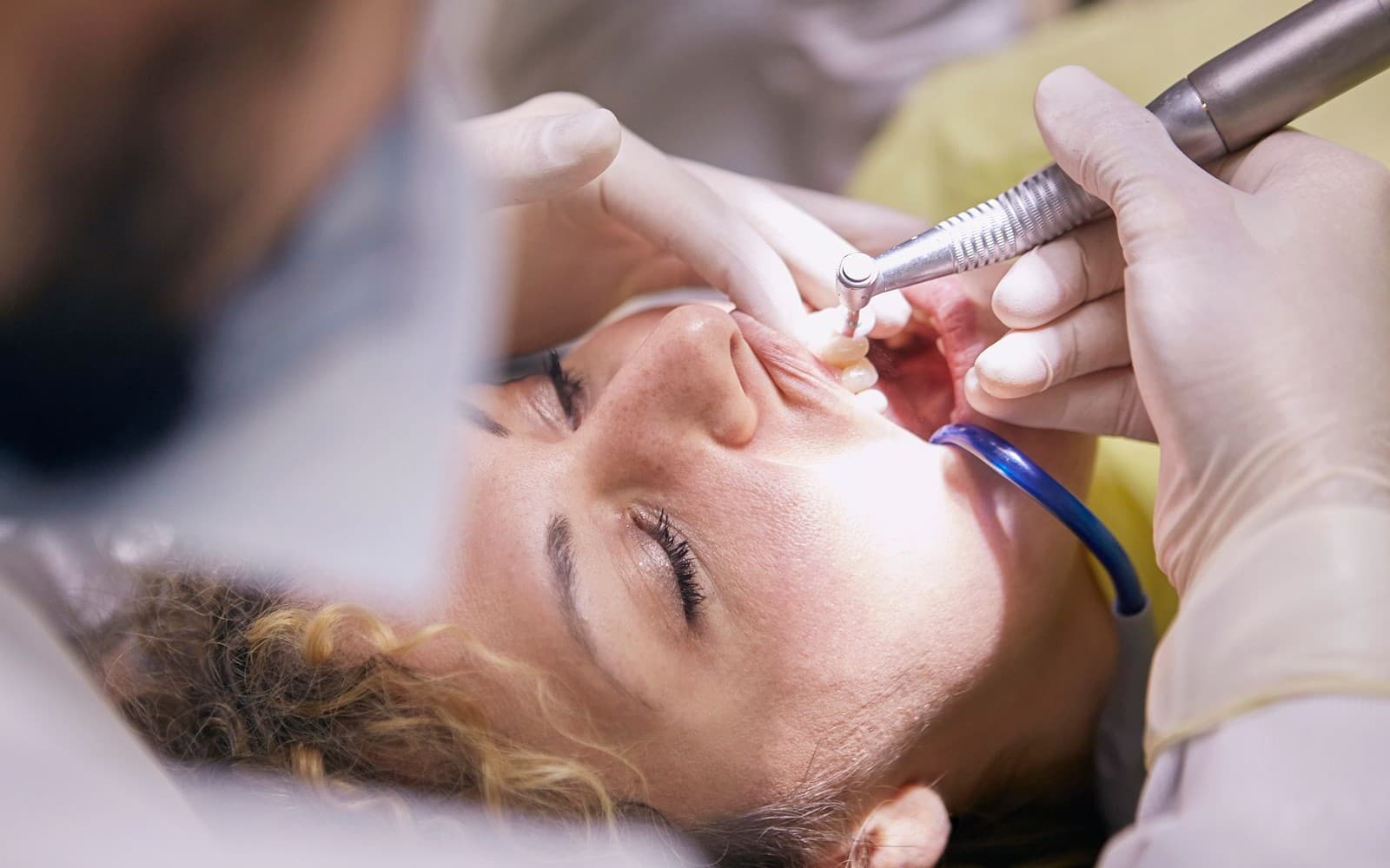 Dentist speaking with a patient during a consultation